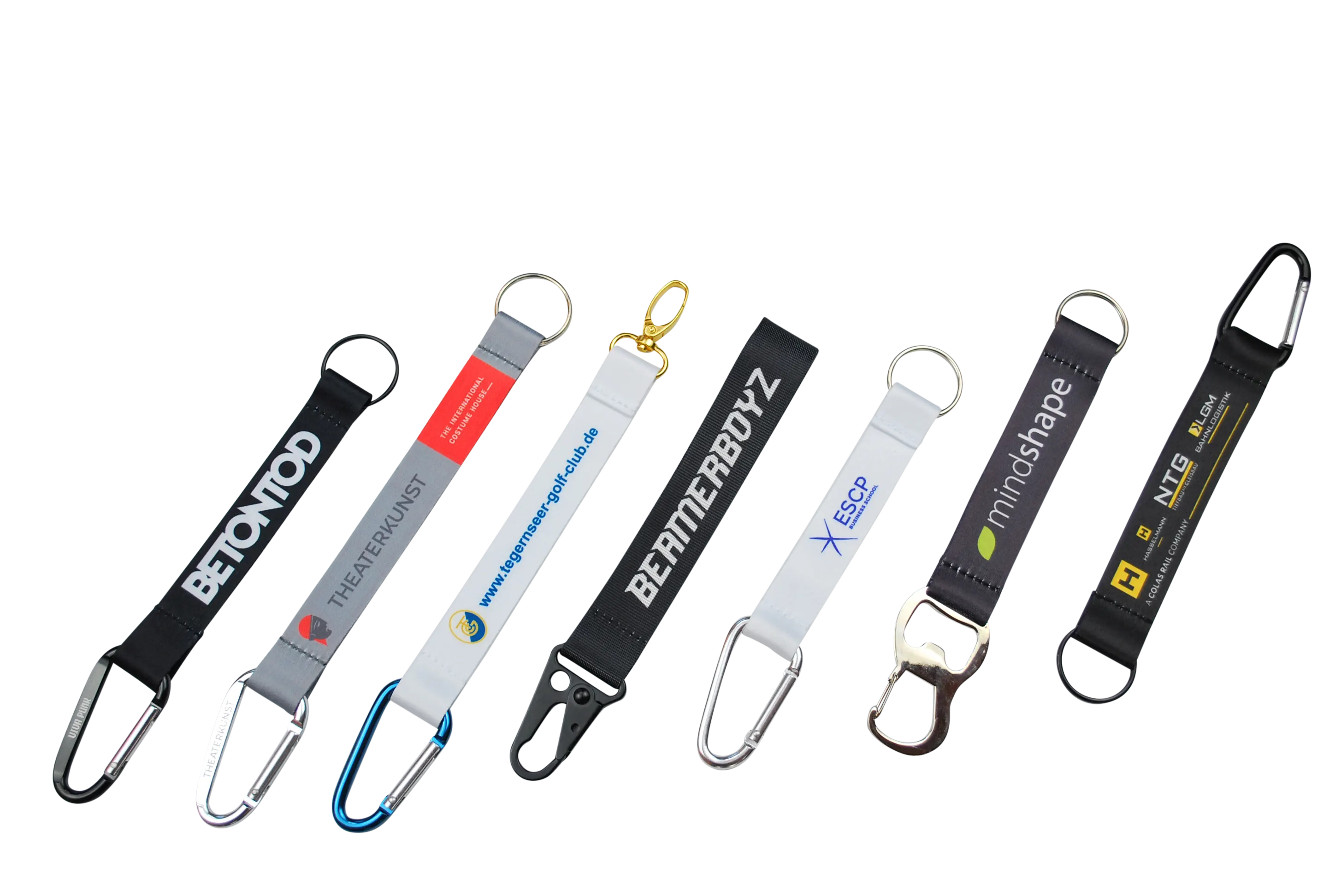 Verschiedene Schlüsselanhänger mit Logo- und Textdruck in unterschiedlichen Farben und Designs.