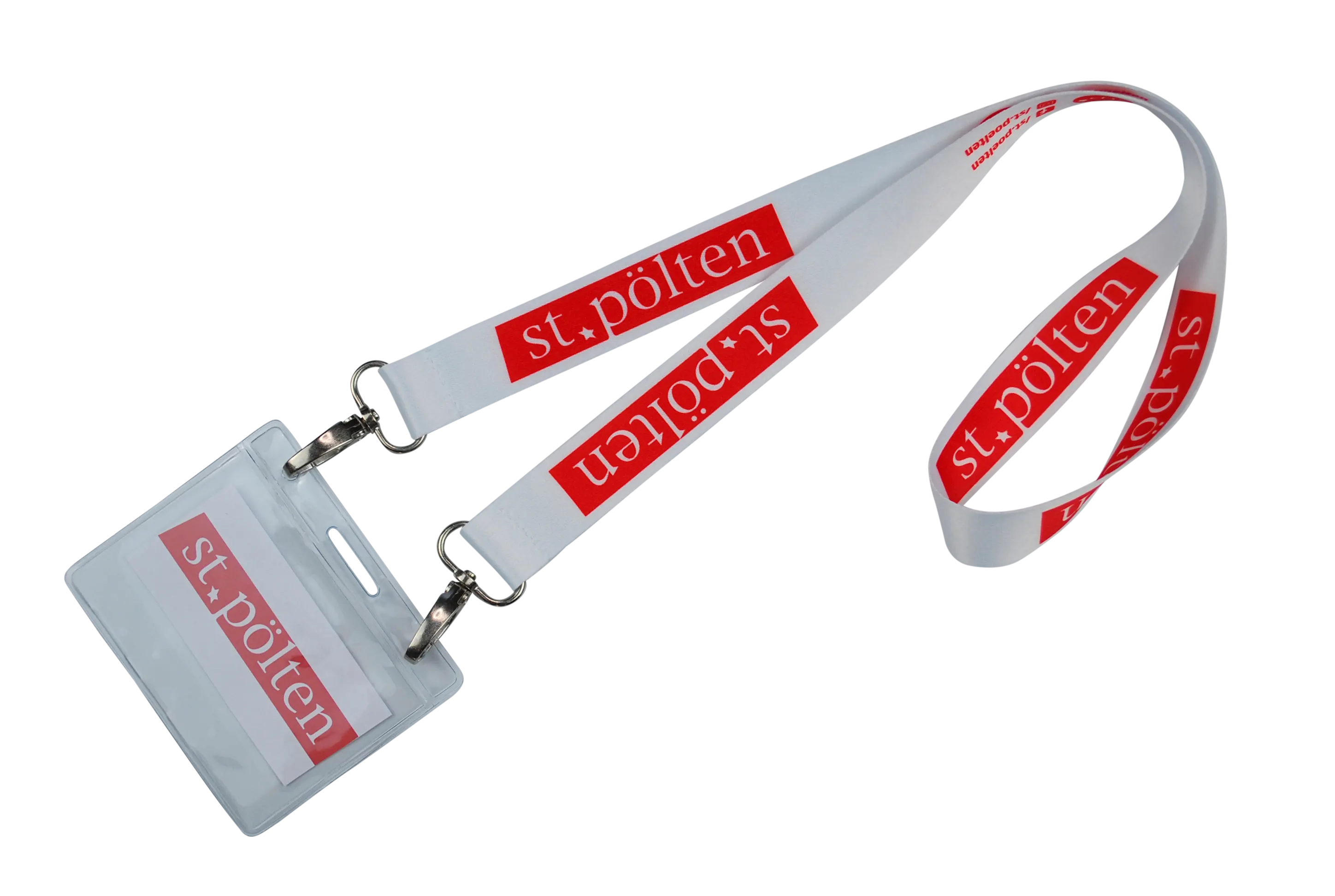 Ein Namensschild mit einem weißen Band, bedruckt mit "st. pölten" in roter Schrift.
